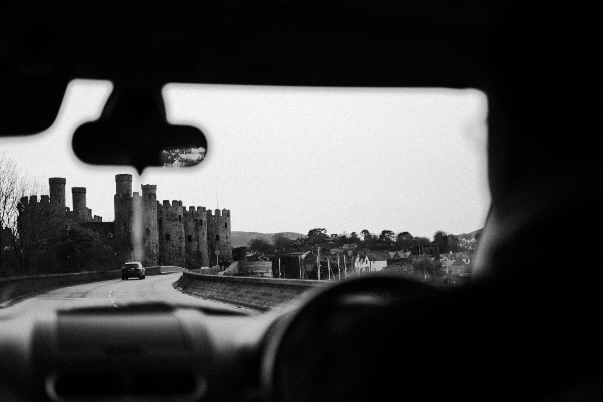 Person in car driving past an castle