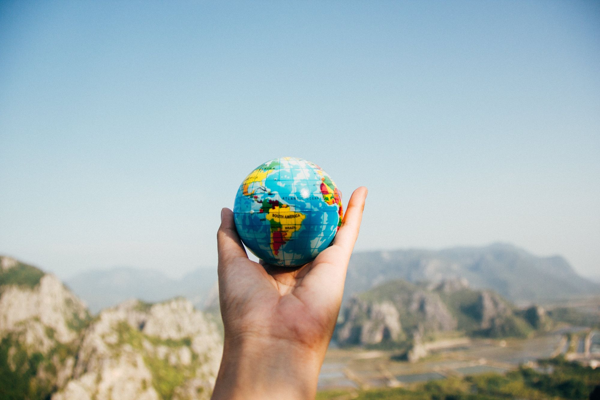 Hand holding an earth