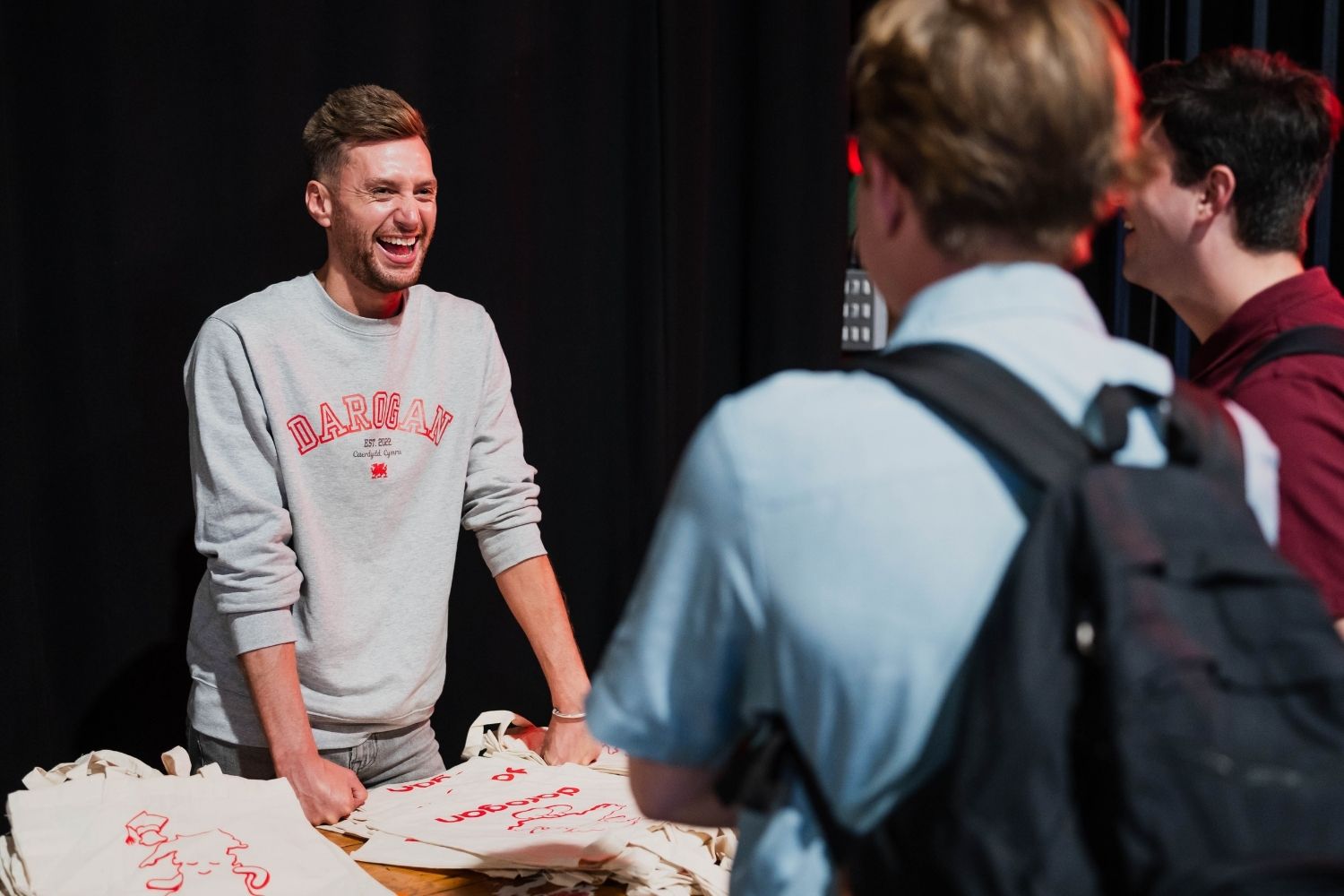 Employer laughing with students